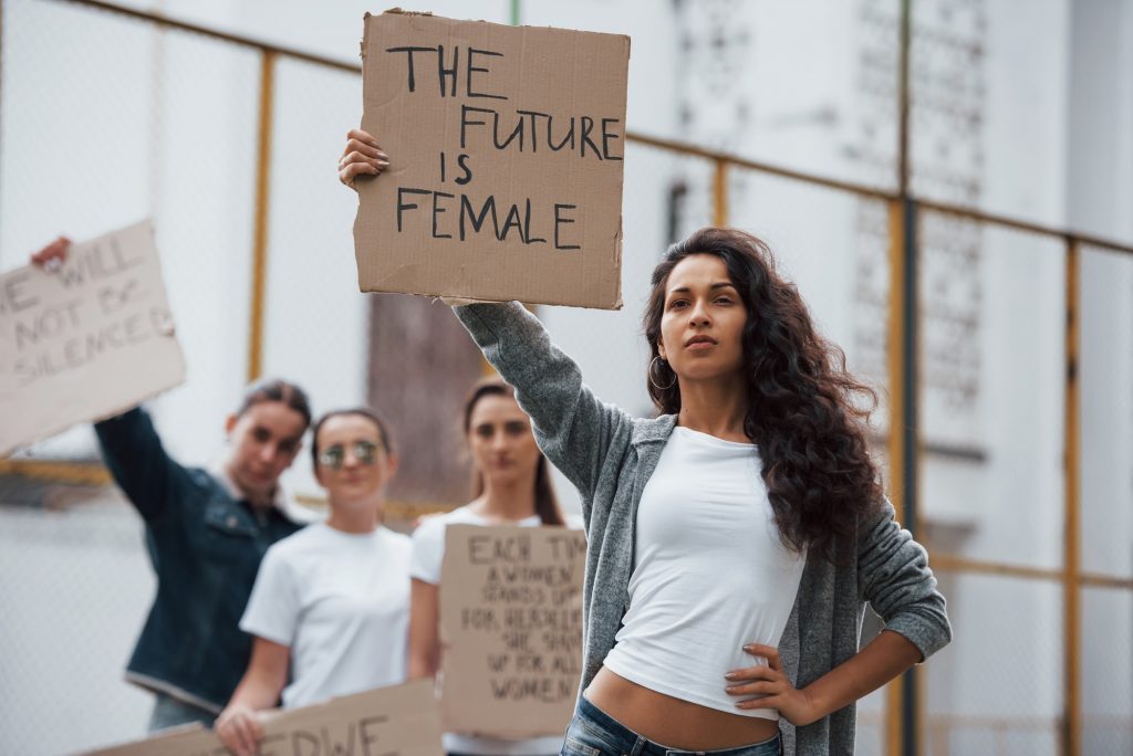 Strong woman. Group of feminist girls have protest for their rights outdoors